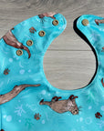 Loutres _ Bavette imperméable évolutive 5 à 12 mois