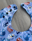 Caméléons _ Bavette imperméable évolutive 5 à 12 mois