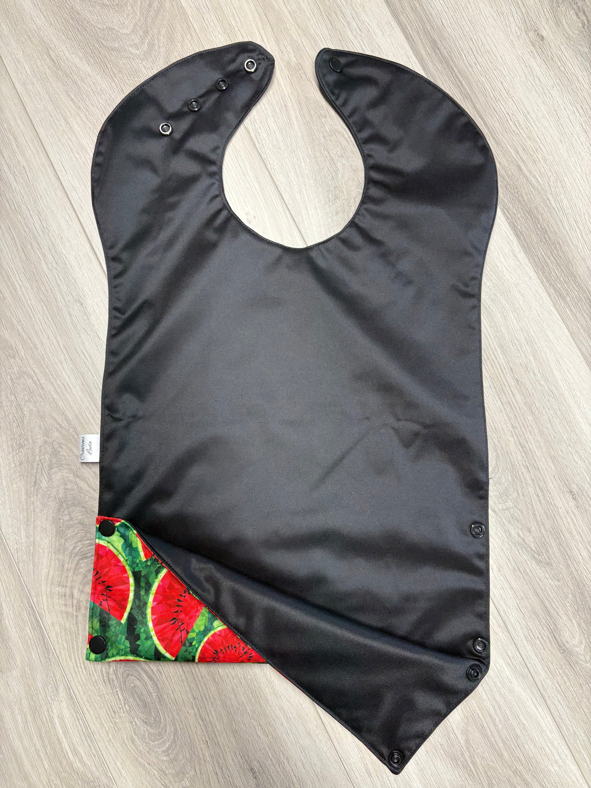 Bavette imperméable évolutive 1 à 4 ans :  noire et melons