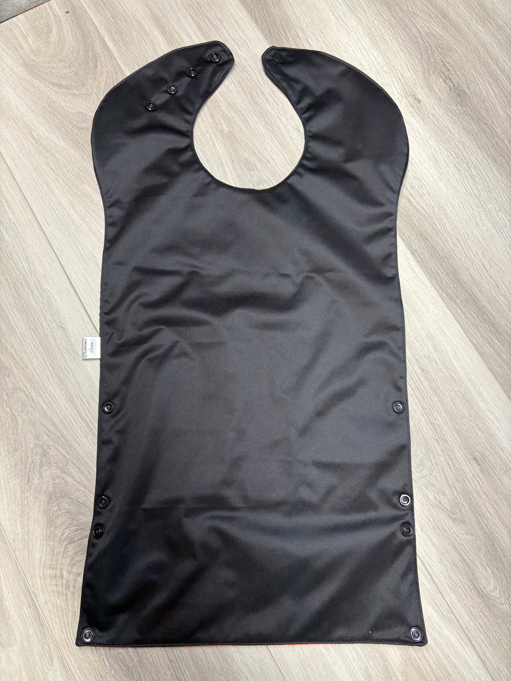 Bavette imperméable évolutive 1 à 4 ans :  noire et melons